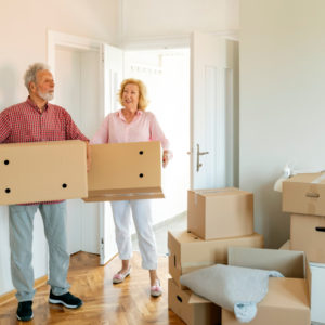 Older couple with moving boxes